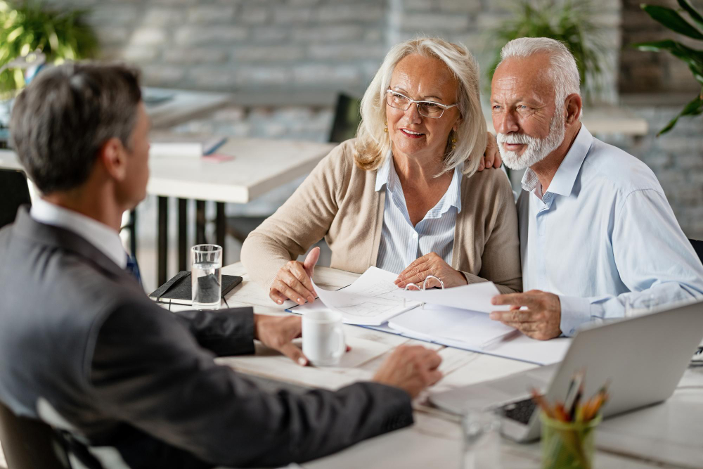 Couple reviewing retirement plan Retirement seminar on preservation and income planning at Fairway Retirement